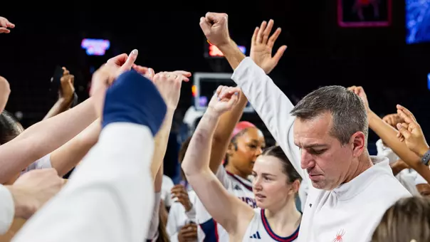 Coach Roussell in a pregame huddle