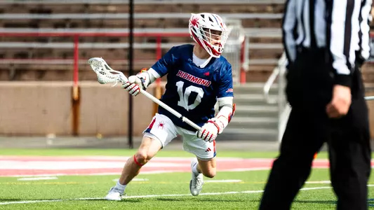 Gavin Creo dodging his defender during Richmond's 8-7 win over Cornell on Feb. 28, 2026