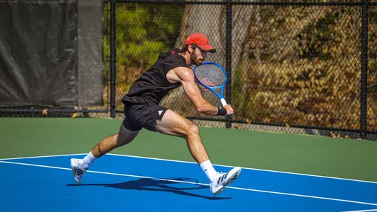 Cole Brashear hitting a tennis ball