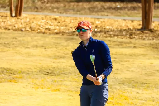 Addie Doroh evaluates her chip from the rough