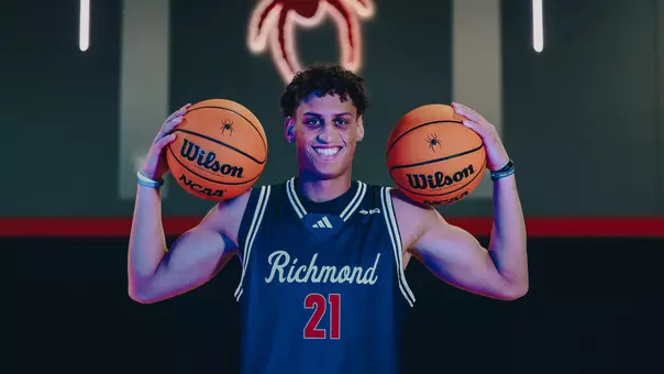 Jamie Kaiser Jr. poses with two basketballs