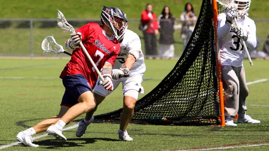 Joe Sheridan carries the ball past his defender against St. Bonaventure on April 11, 2026
