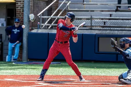 Evan Wilson lays off a high pitch against URI