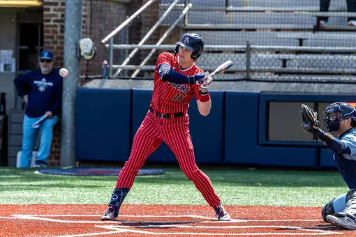 Evan Wilson lays off a high pitch against URI