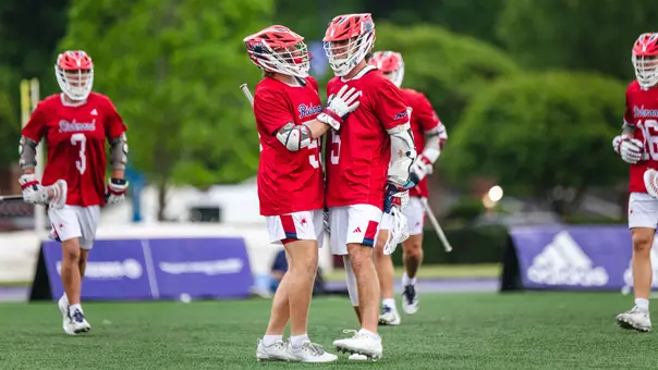 Brothers Aidan and Evan O'Neil celebrate a goal at High Point on April 24, 2026