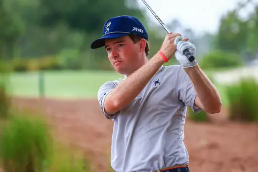 Quin Polin stares down his line to the green