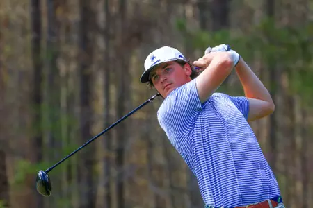 Tommy Sharps follows his drive down the fairway