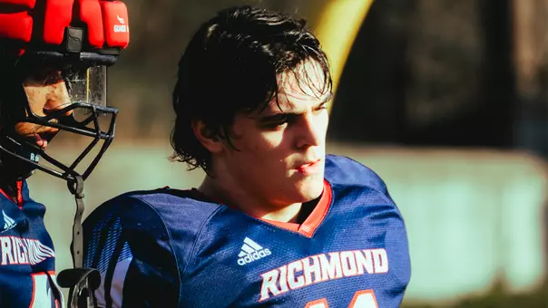 Blake Houser stands during spring football practice