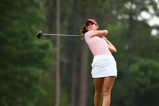 Katie Magner grimaces as she hits a drive