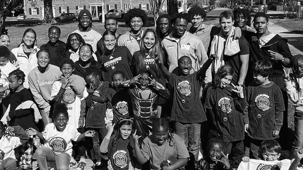Spider student-athletes pose with students from Chimborazo Elementary School