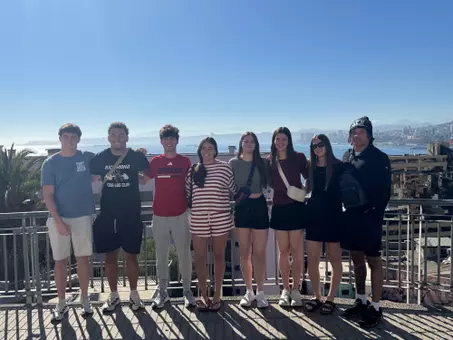 Spider student-athletes pose on an overlook in Chile