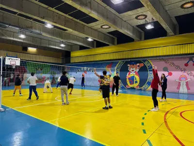 Spider student-athletes compete in a volleyball match with local students in Chile