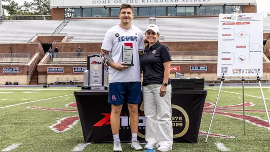 Joe Sheridan receiving his A-10 All-Tournament Team trophy