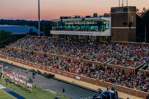 Dusk falls on a full sideline at Robins Stadium