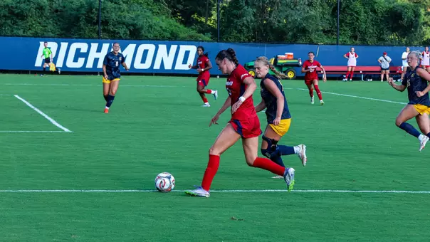 Emma Newman dribbling against ETSU