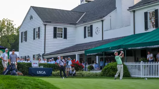 Matthew Lowe hits his tee shot on the first hole of the US Amateur Championship