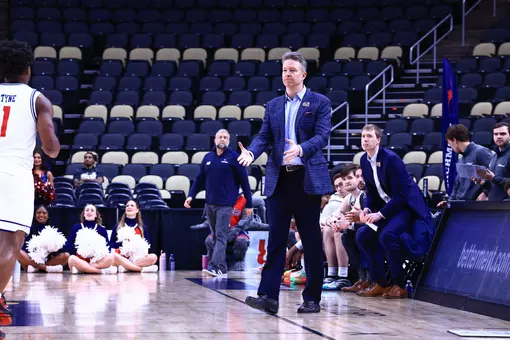 Chris Mooney welcomes a player off the floor