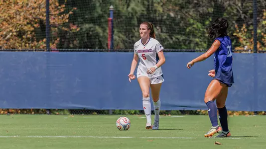 Erika Schneider looks up the field with the ball at her feet