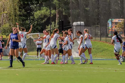 The Spiders team celebrates after scoring a goal
