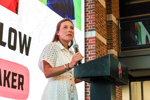 Calle Barlow speaks from a lectern