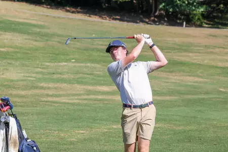 Quin Polin follows through after a wedge shot from the fairway