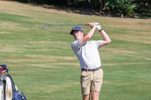 Quin Polin follows through after a wedge shot from the fairway