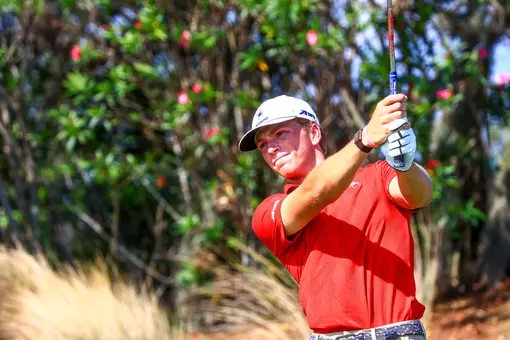 Parker Moellinger takes a practice swing on the tee box