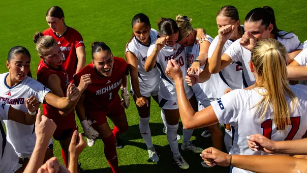 The Richmond women's soccer team huddles before a game