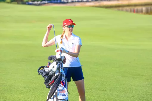 Addie Doroh pulls a club out of her bag