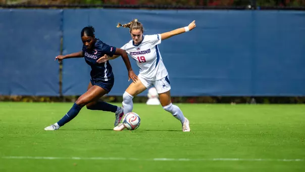 Paige West battles an opponent for the ball