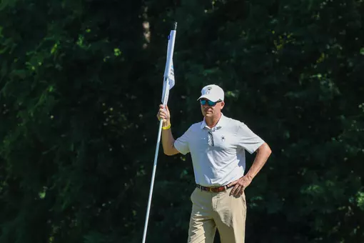 Adam Decker holds a flag