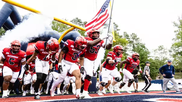 Richmond football team running out of the tunnel before its game against Furman on Sept. 26, 2026