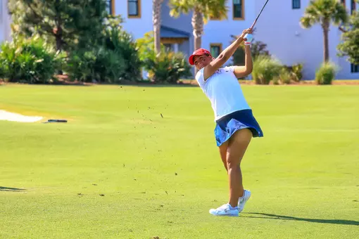 Maya Beasley fires an iron into the green