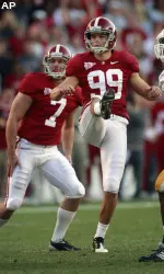 Alabama place kicker Leigh Tiffin watches his fourth field goal of the day go through the uprights. (AP Photo/Dave Martin)