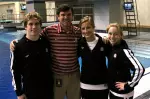 Junior Aaron Fleshner, diving coach Pat Greenwell, junior Elizabeth Hughes and freshman Carrie Dragland.