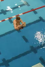 Adam Booher won the three-meter board Saturday with a career-best score of 358.90