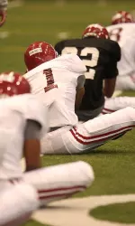 Crimson Tide work out inside the Hank Crisp Indoor Facility on Wednesday.