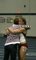 Rachel Robbs is congratulated by head coach Sandy Fowler.