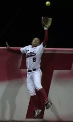 Brittany Rogers robs a potential home run in the fifth.