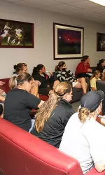 Alabama players wait for their names to be called Sunday night on ESPNU.