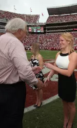 Four-time All-American Ashley Priess receives her 2009 SEC Championship ring from director of athletics Mal Moore.