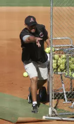 Alabama head coach Patrick Murphy tosses BP during the start of fall practice.