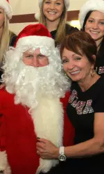 Coach Sarah Patterson and Santa at the annual RISE Christmas party at the Frances Smith Practice Facility.