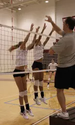 Freshman Morgan Hendrix and senior Calli Johnson team up for a block.