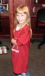 Easter Seals Ambassador Lexi White takes a tour of the Alabama gymnastics locker room.