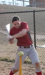 Courtney Conley works on her swing on the first practice of the year.