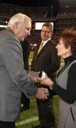 Director of Athletics Mal Moore presents Sarah and David Patterson with their fifth NCAA Championship rings.