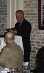 Alabama soccer coach Todd Bramble gives out an award at Chuck's Fish for the annual Awards Banquet.