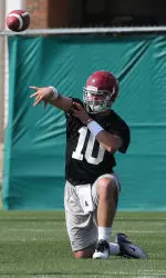 AJ McCarron warming up for Friday's practice at the Thomas-Drew Practice Facility.