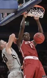 Alabama's JaMychal Green (1) dunks against Colorado's Austin Dufault in the first half of a semifinal in the NIT college basketball tournament, Tuesday, March 29, 2011, at Madison Square Garden in New York. (AP Photo/Mary Altaffer)